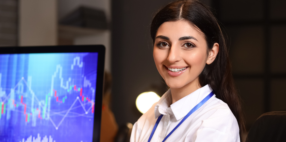 A lady in an office, working on a sales presentation, representing a senior business process architect 