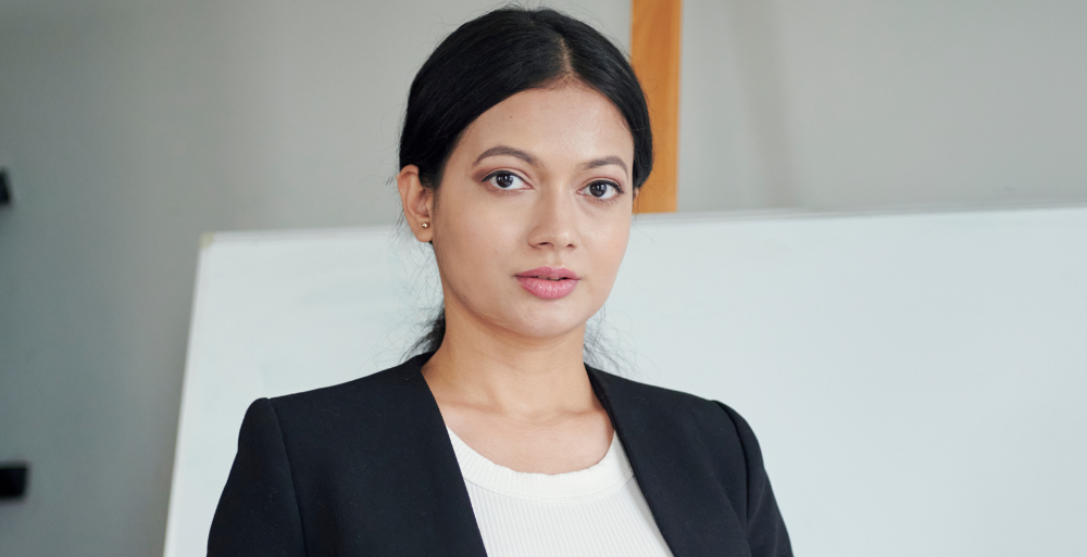 A lady wearing formal wear in an office representing a sales representative 