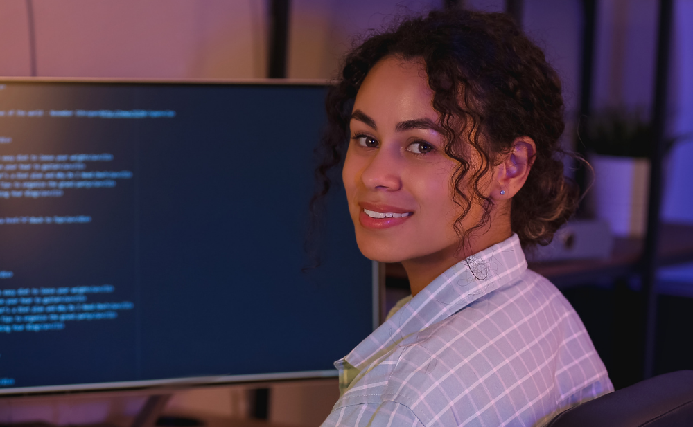A lady wearing formal wear in an office representing a senior software engineer 